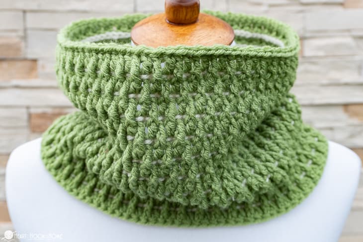 Sage green and white example of the I\'ll Pine For You crochet pattern on a white dress form.